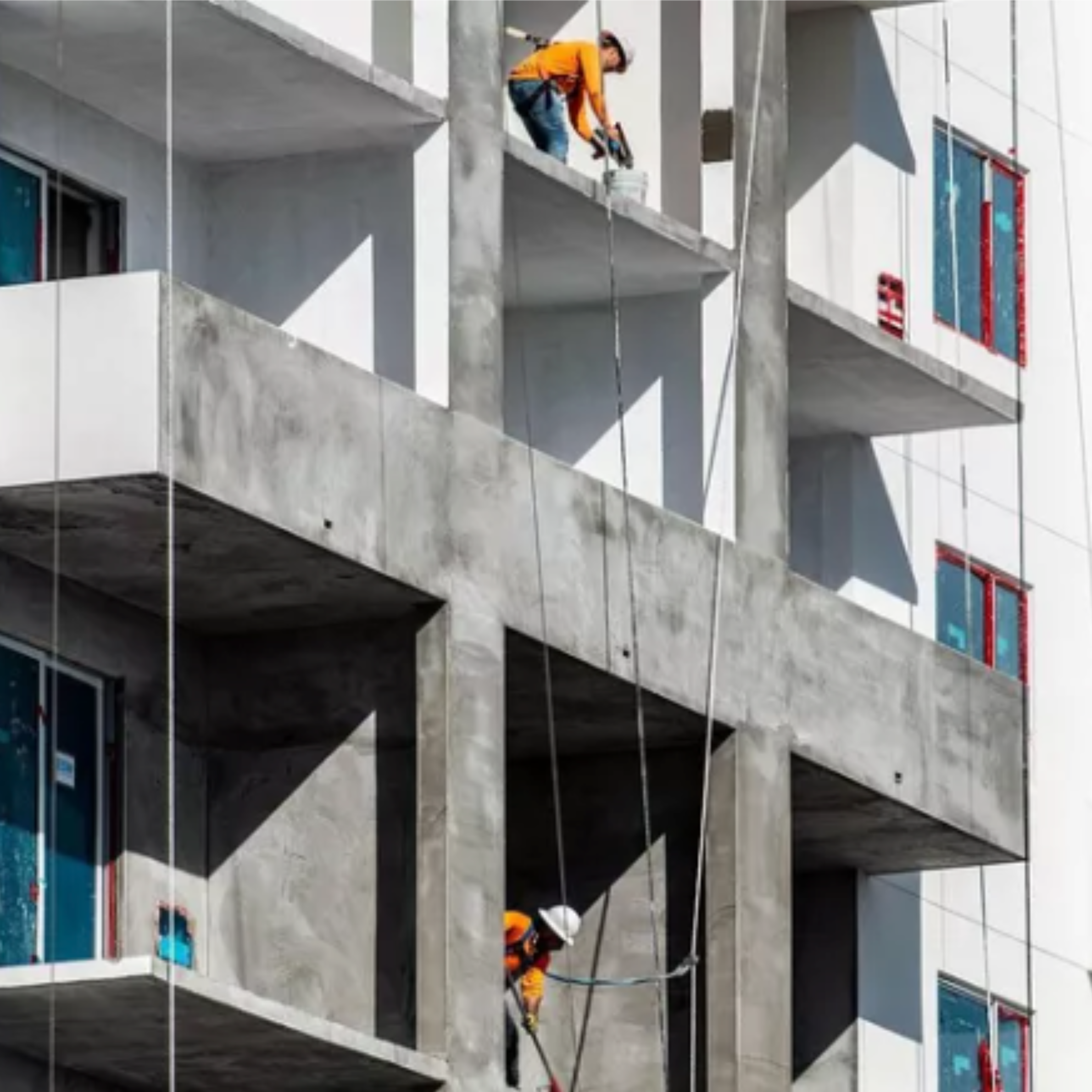 Construction workers on a multifamily development building in Dallas-Fort Worth, Texas — Senate Bill 840 SB 840 commercially zoned land housing development DFW